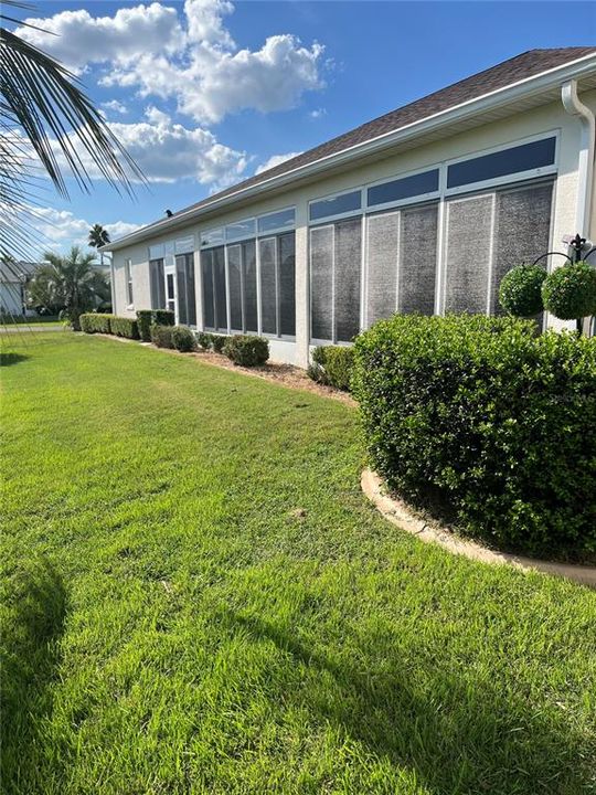 BACKYARD VIEW OF SUNROOM ENCLOSED LANAI