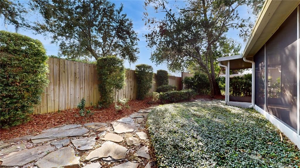 LUSH BACKYARD WITH SLATE DRIVEWAY