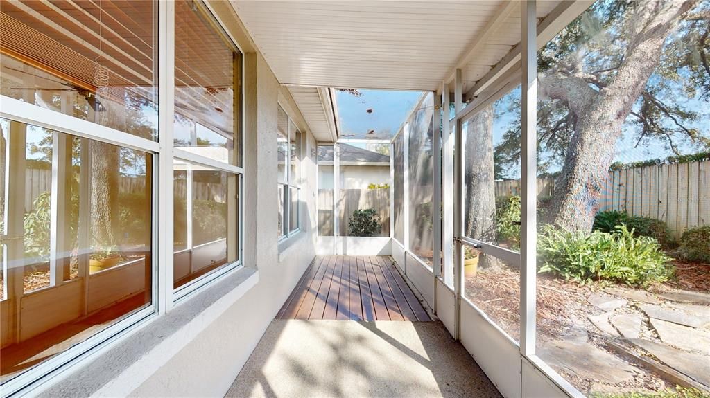 EXPANSIVE SCREENED PORCH OVERLOOKING BACKYARD