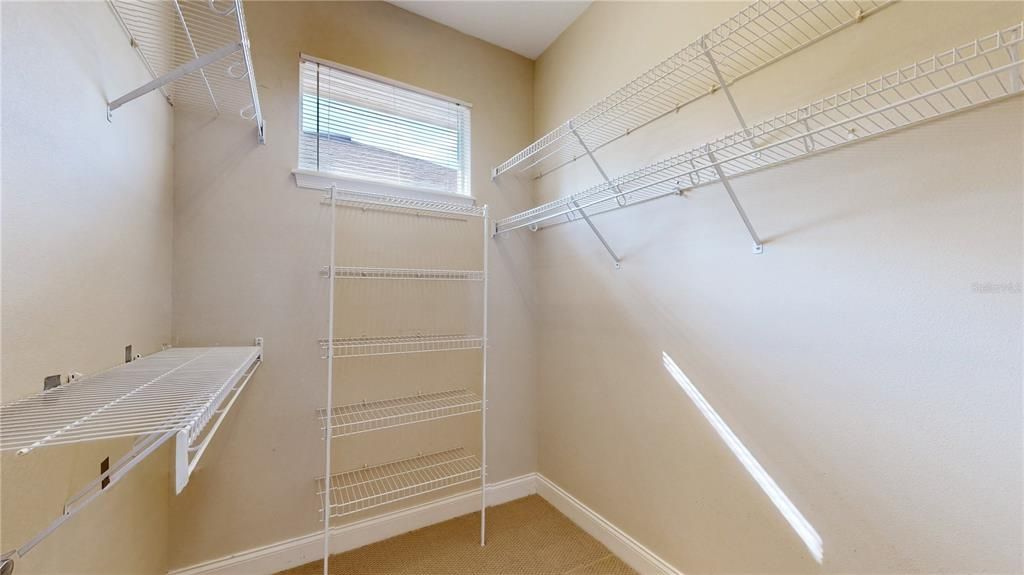 PRIMARY BEDROOM WITH WALK IN CLOSET