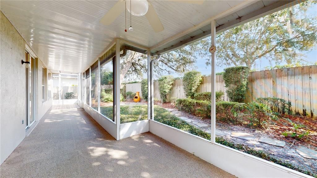 VIEWS OF SCREENED PORCH AND BACKYARD