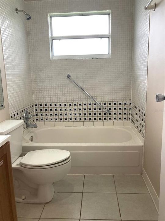 Guest bathroom, tub and shower.