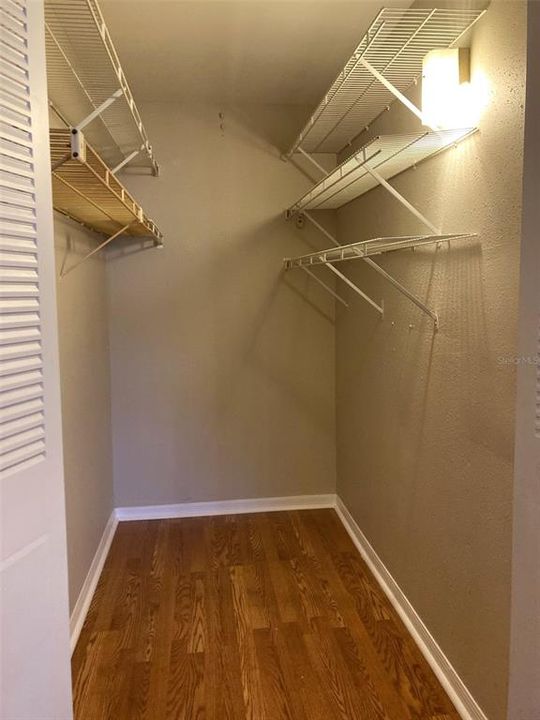 Walk-in closet in primary bedroom.