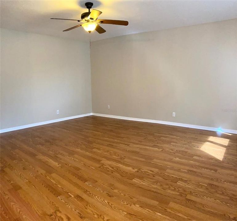 Living room, hardwood flooring, good natural light.