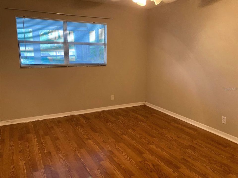 Primary bedroom, hardwood floors.