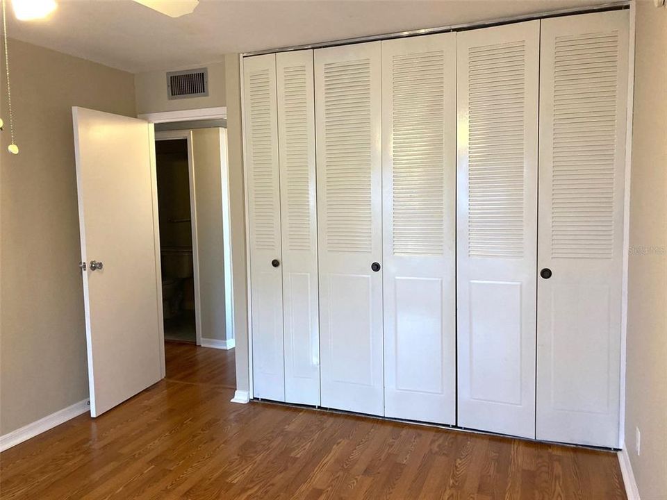 Wall closet in second bedroom.