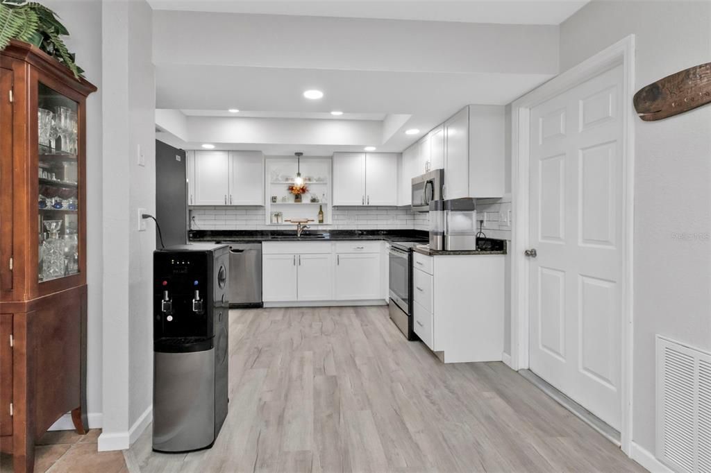 Kitchen features laminate flooring.