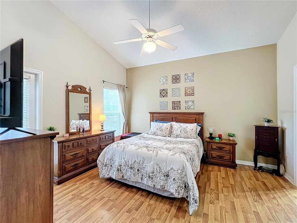 Primary Bedroom with Wood laminate flooring