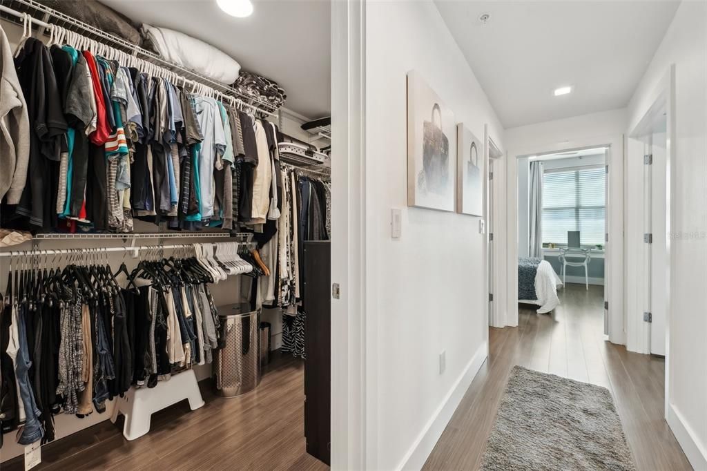 The dual entrance walk in closet provides plenty of space to organize everyone wardrobe and provide easy access to everything.