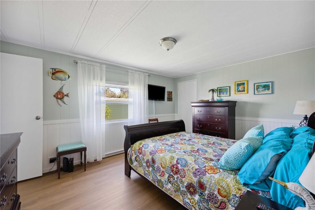 Primary bedroom with new laminate floors