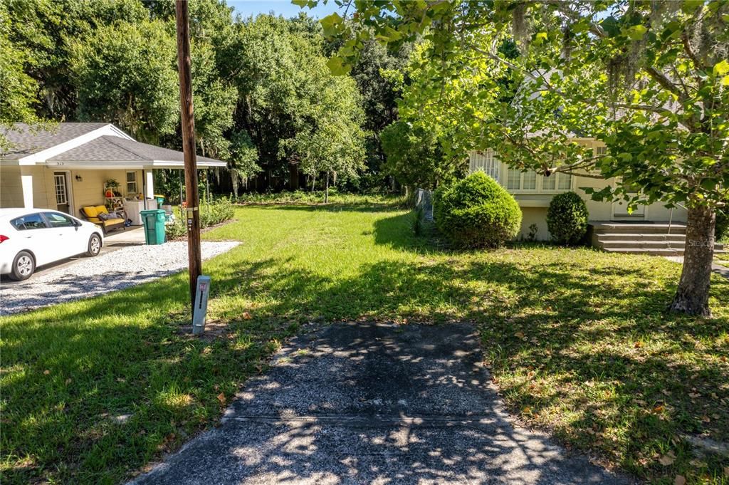 Entry into lot off paved road (Oak Ave)