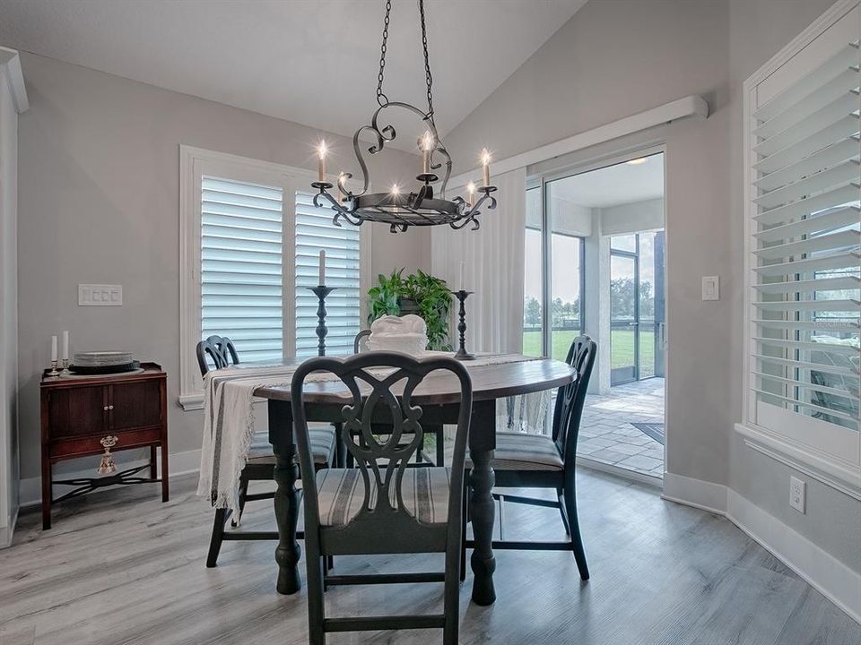 LOVELY CUSTOM LIGHT FIXTURES AND PLANTATION SHUTTERS THROUGHOUT THE HOME. SLIDING GLASS DOORS FOR A GREAT VIEW AND EASY ACCESS TO THE POOL AREA.