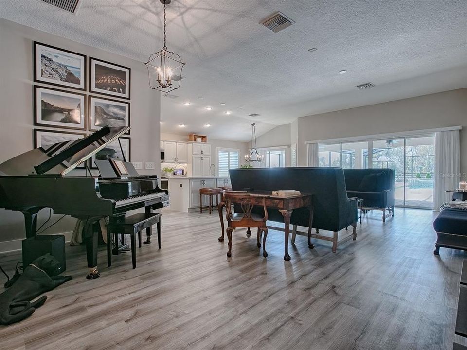 BEAUTIFUL LUXURY VINYL PLANK FLOORING THROUGHOUT THE ENTIRE HOME! FORMAL DINING ROOM IS BEING USED FOR THE PIANO SINCE THERE ARE OTHER DINING OPTIONS IN THIS VERSATILE HOME.