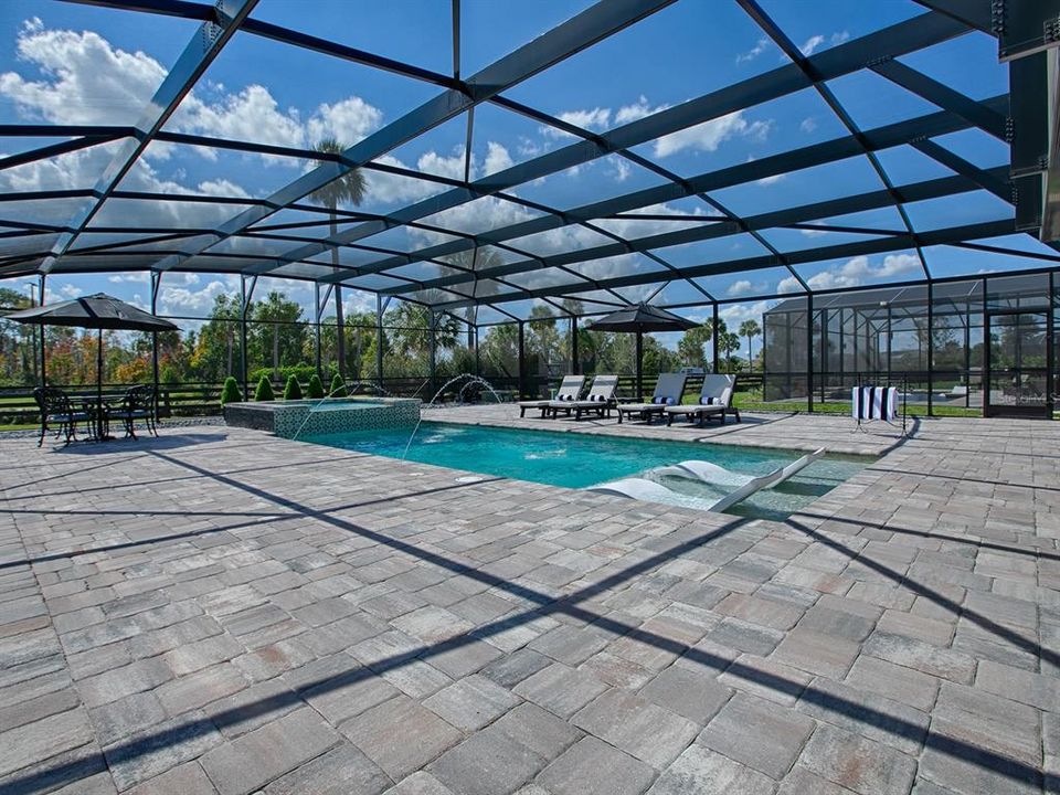 APPROXIMATELY 3500 SF OF OUTDOOR LIVING SPACE. THE POOL IS 28X12.