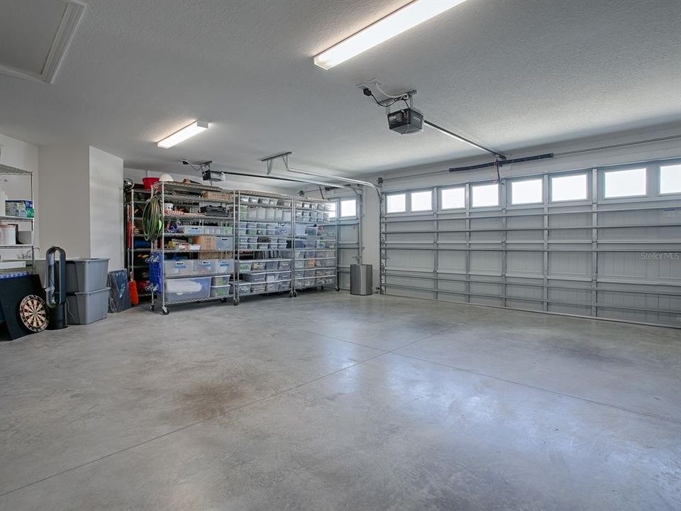 OVERSIZED GARAGE WITH ENOUGH SPACE FOR 2 GOLF CARTS WHERE ALL THE STORAGE IS NOW.