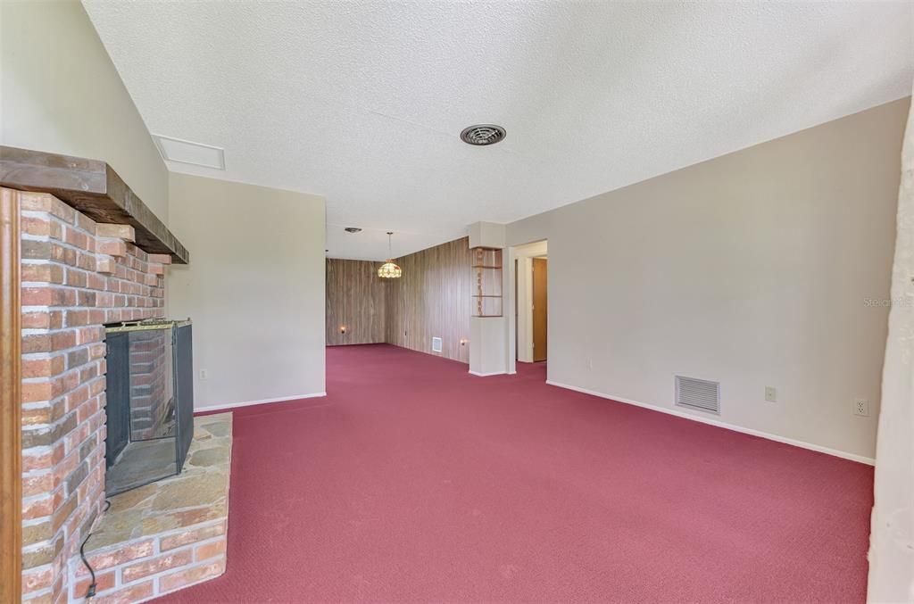 LIVING ROOM WITH BRICK-WOOD BURNING FIREPLACE (NOT WARRANTED.)