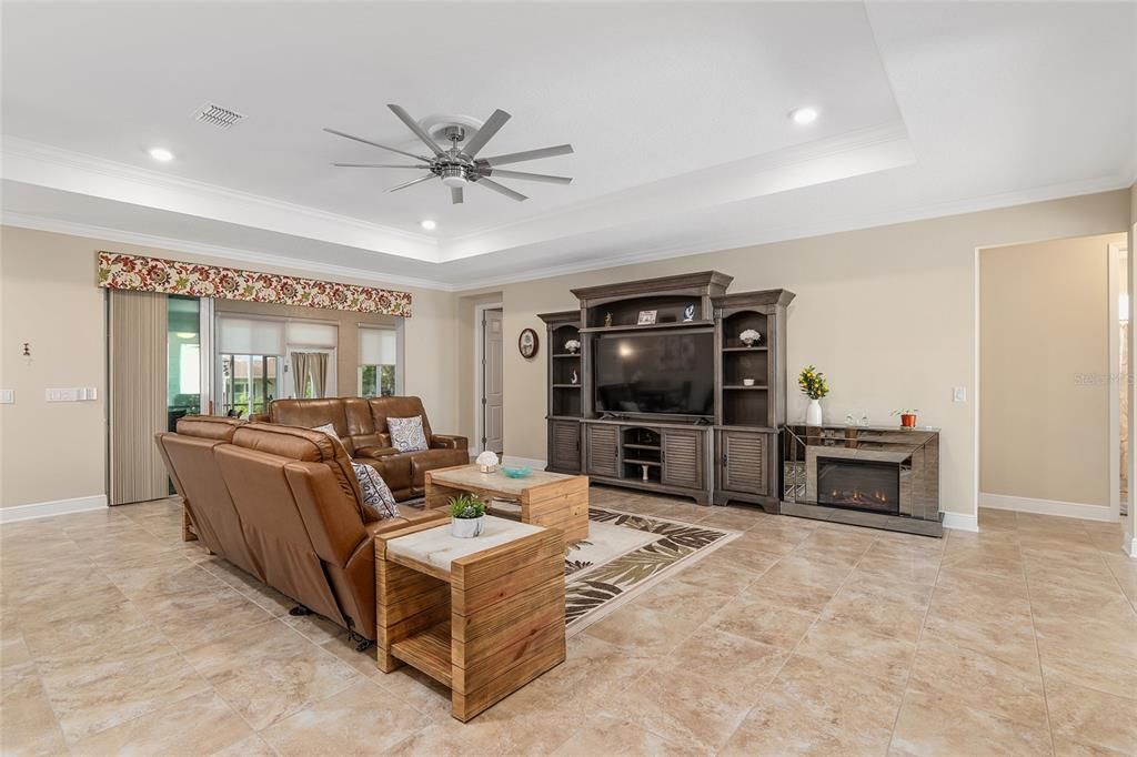 Pretty electric fireplace next to cabinet with TV