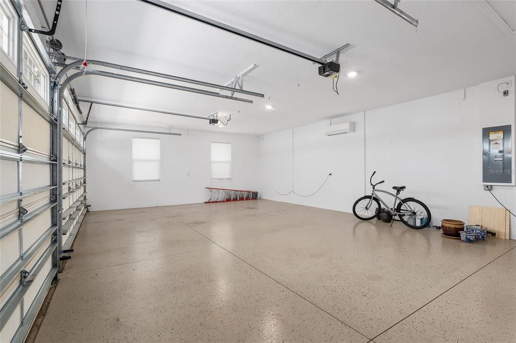 Upgraded epoxy floor and a mini-split air conditioner makes the garage a perfect workroom or even a craft room