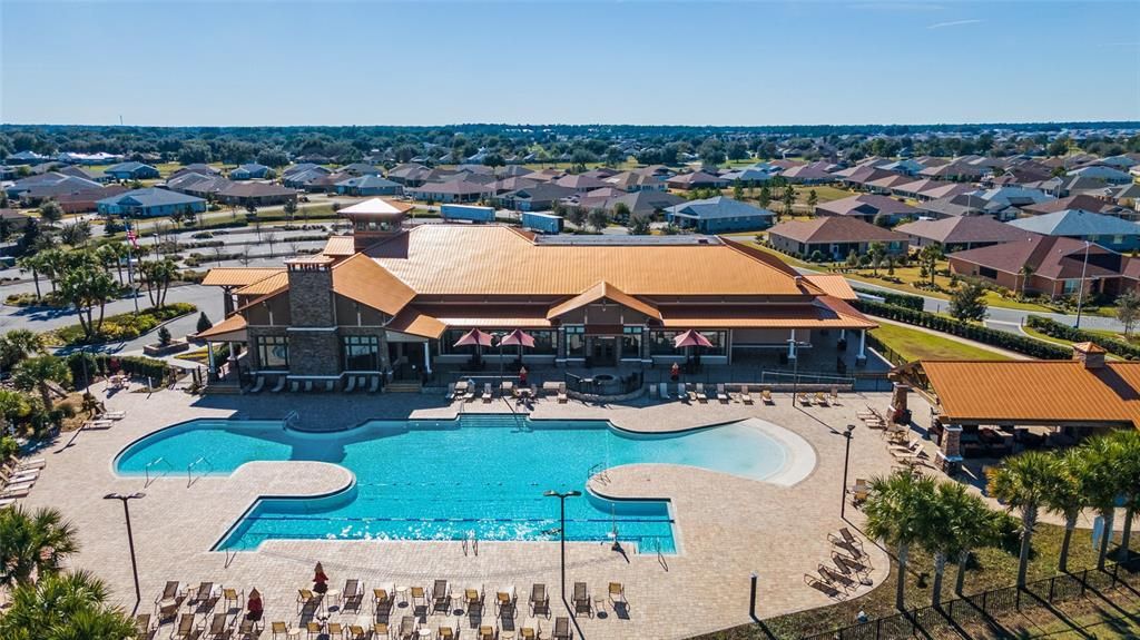 This is a beach entry pool with cabanas and a clubhouse for events