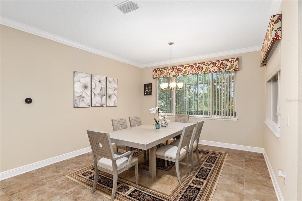 The dining room looks out over the pool