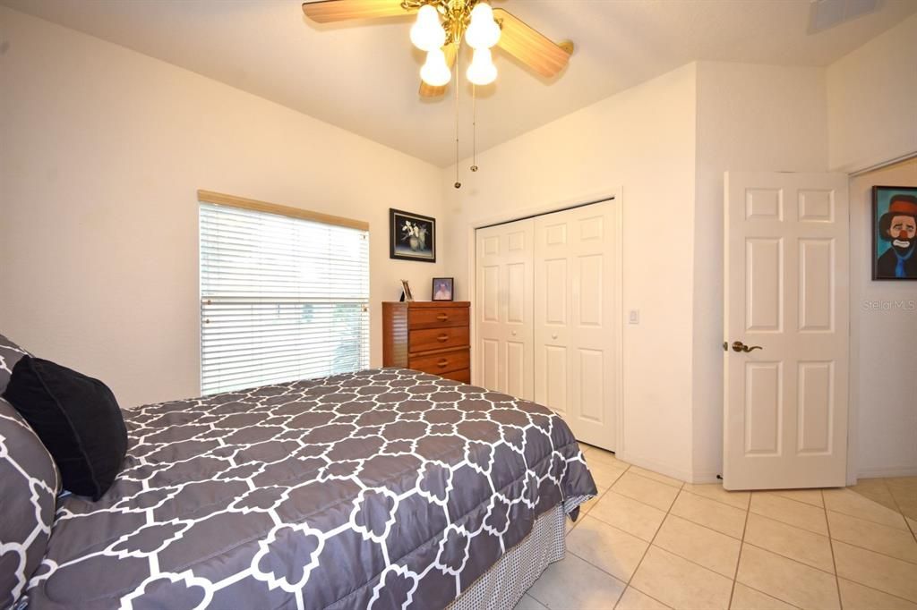 The guest bedroom to the east and south. The large reach in closet provides storage.