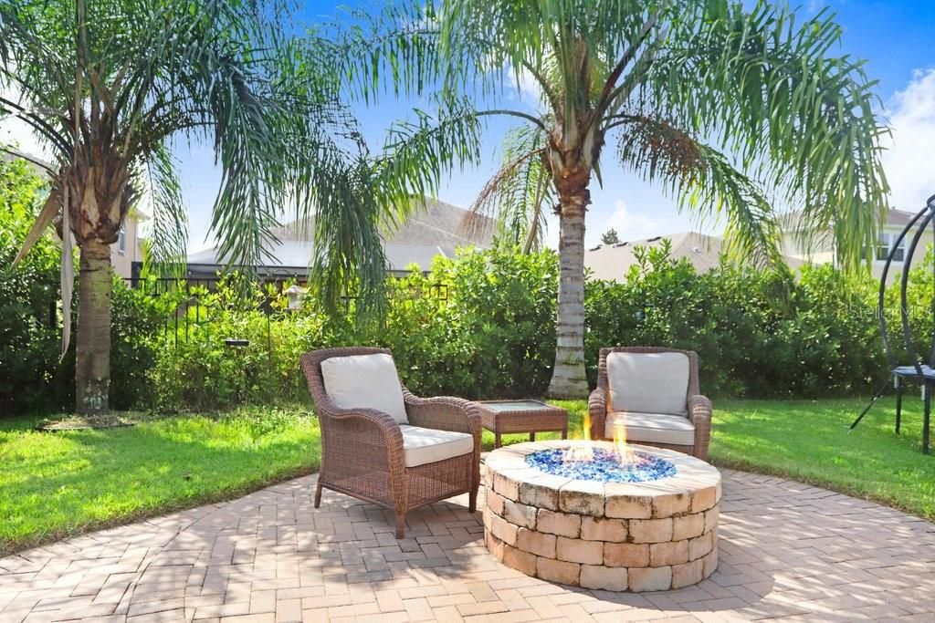 Outdoor sitting area with gas fireplace and beautiful pavers