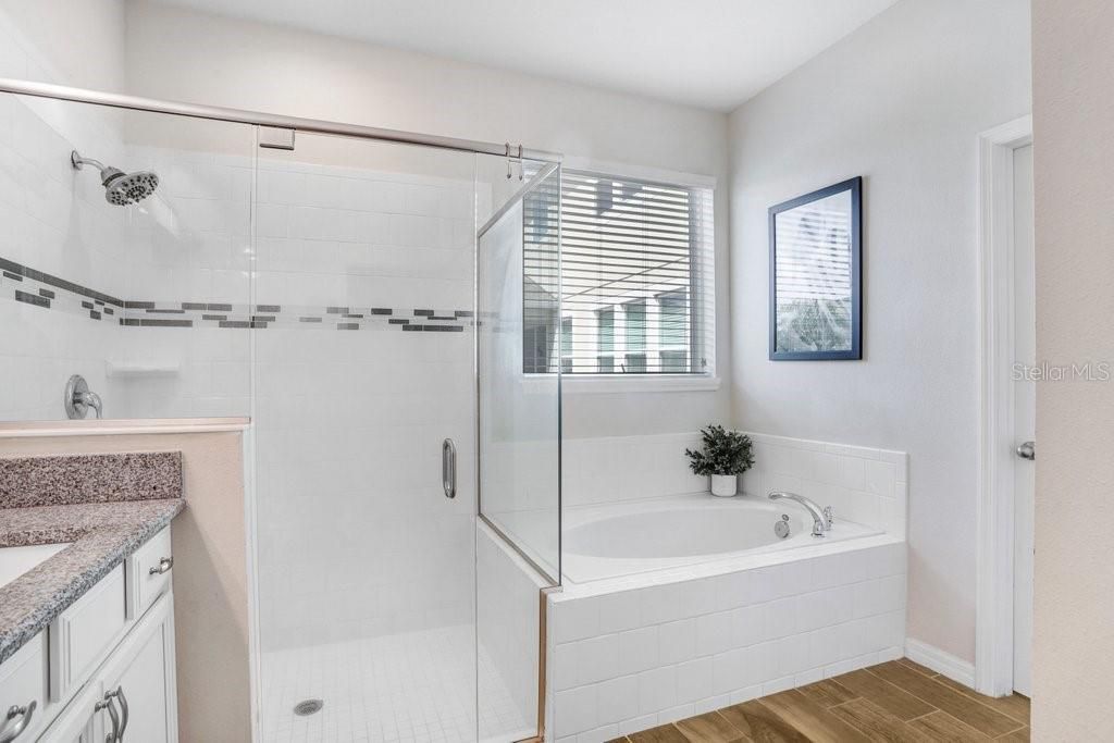 Primary Bathroom with duel sinks and granite countertops, Large walk in Shower, Garden Tub and enormous walk in closet