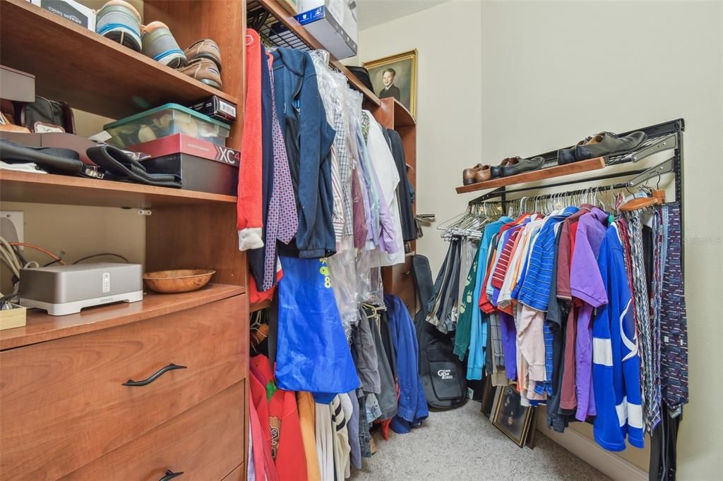 Primary bedroom has 2 walk-in closets with custom shelving system.