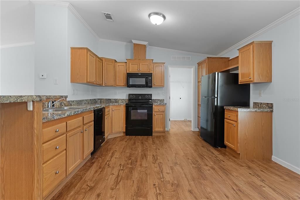 Kitchen with black Whirlpool appliance package included.