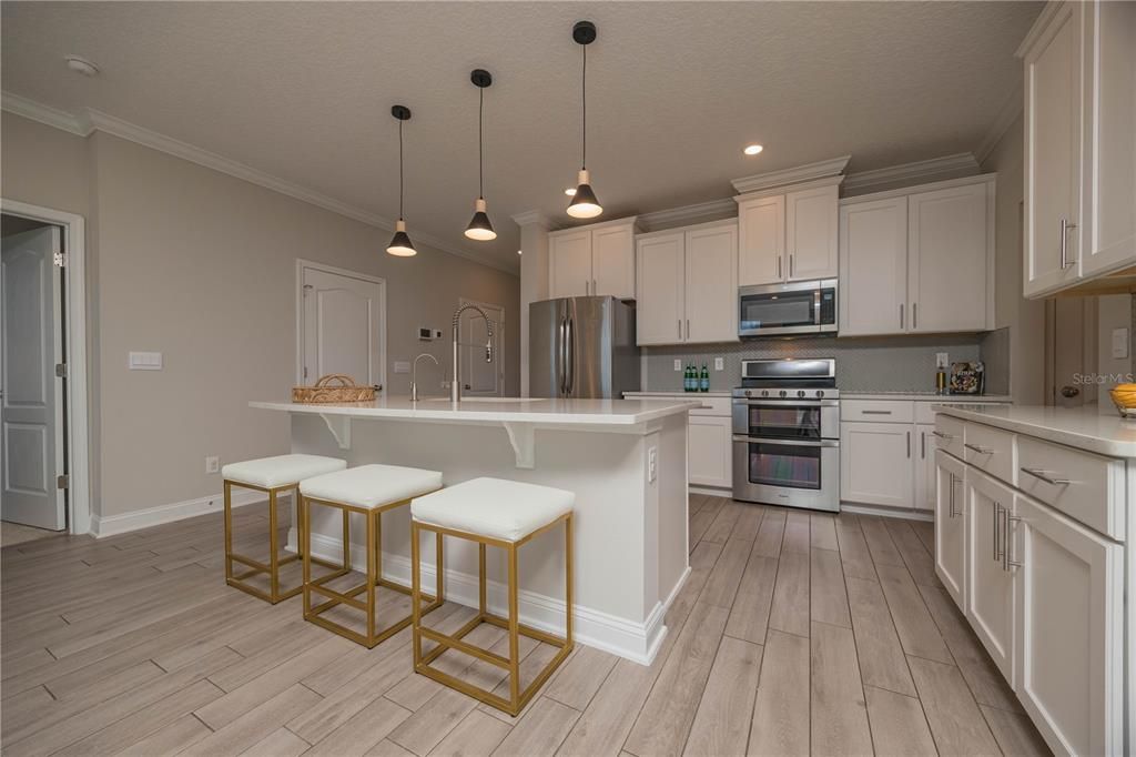 Kitchen With Large Island and Breakfast Bar