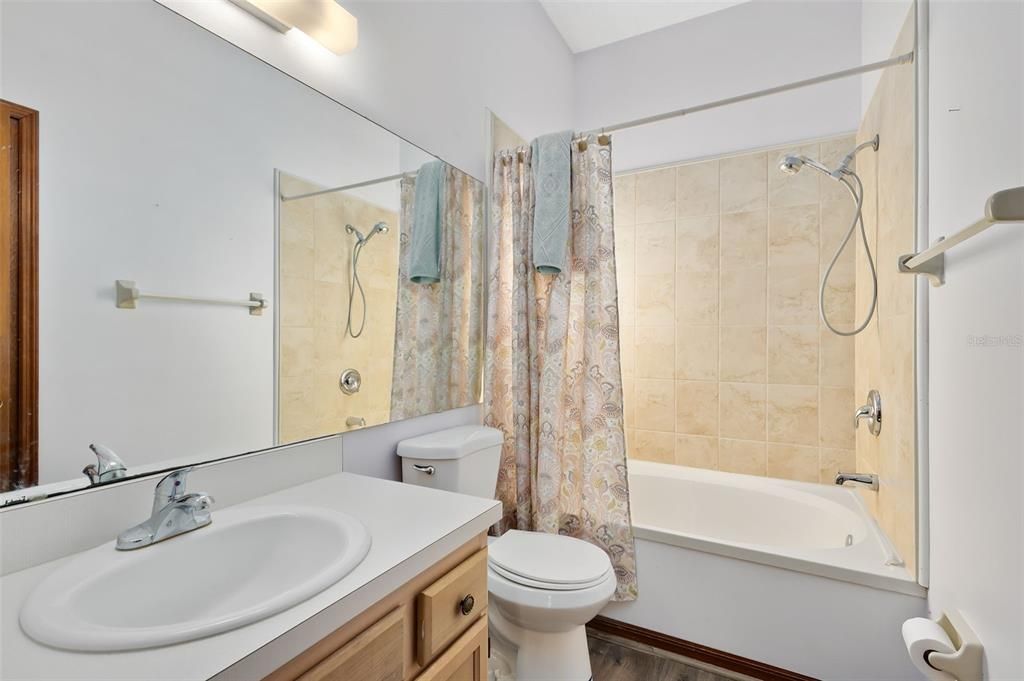 The primary bath has a tub.shower combo.