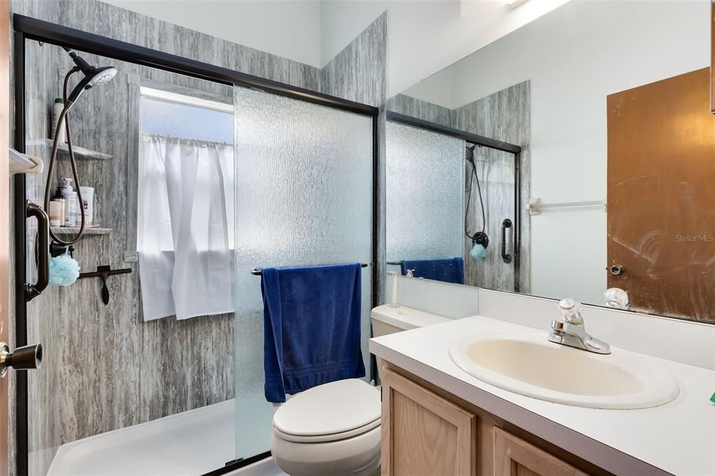 An updated guest bath, complete with a walk-in shower installed in 2022.