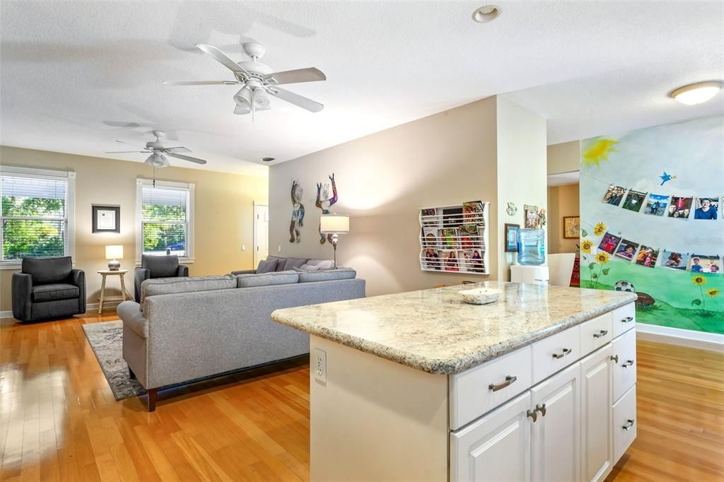 Breakfast nook off the kitchen leads to the screened porch and pool area