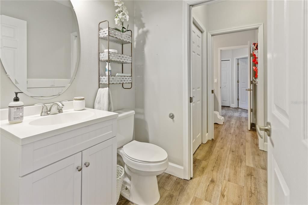 Half bath connects to full bath, creating a jack-n-jill between the two hallways