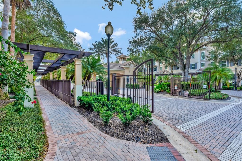 Guest Entrance to Property with Brick-Lined Walk and Garden Pergola