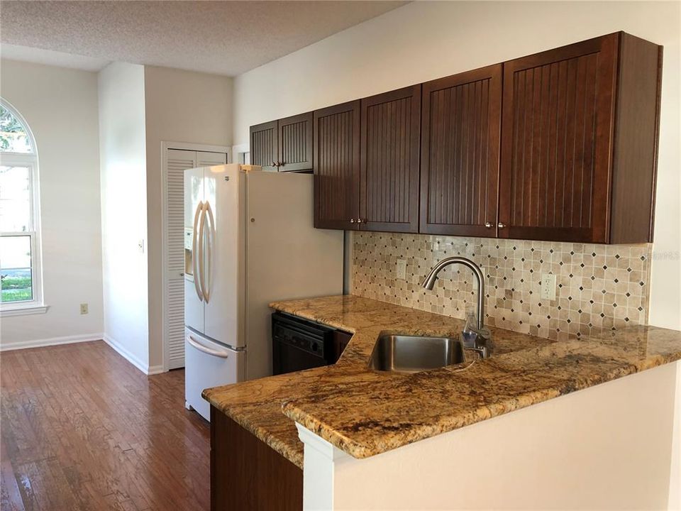 Kitchen features Granite Countertops.