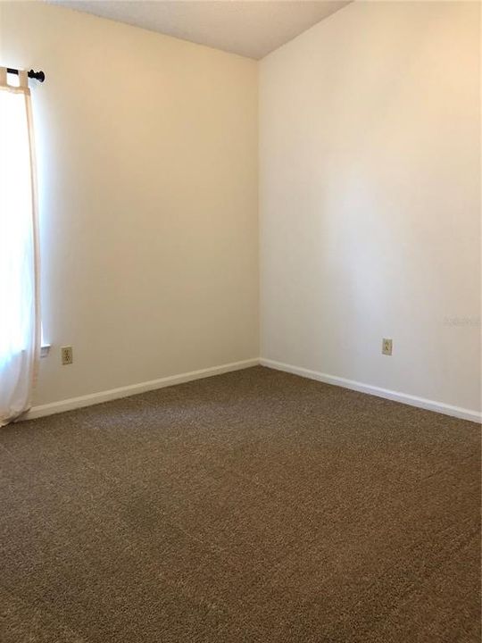 Bedroom 2 features New Carpeting.