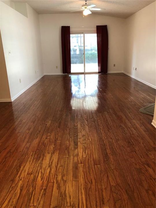 Once You Open The Door....You Will Want To Stay. Family Room with Natural Wood floors.