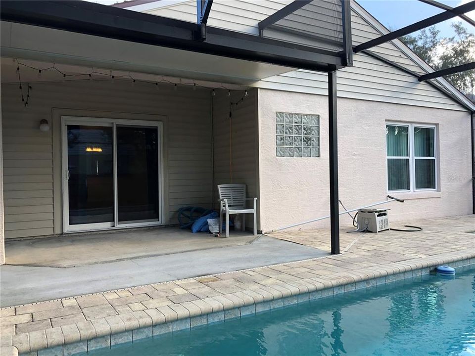 Covered Lanai. Popular Pavers around the Screened Pool.