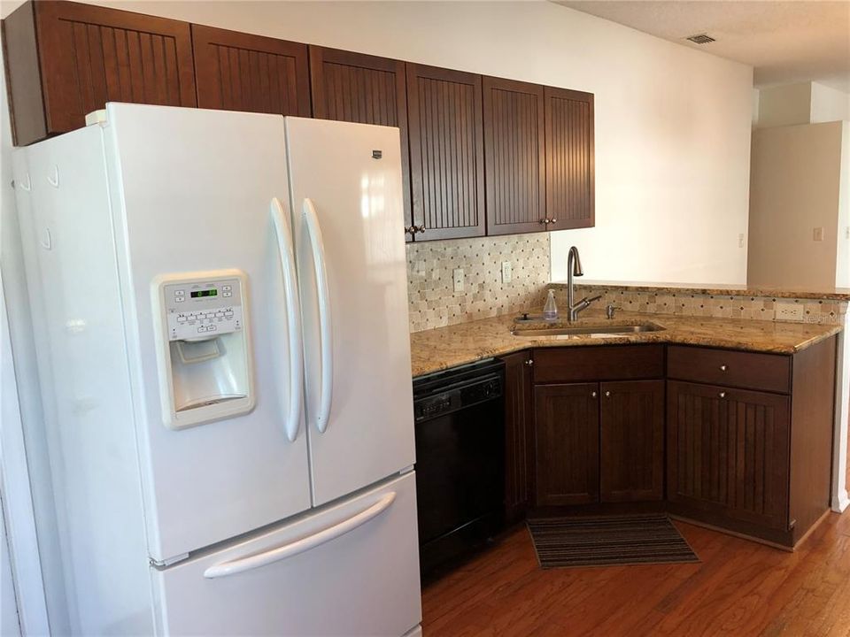 Double door refrigerator and touch water faucet.