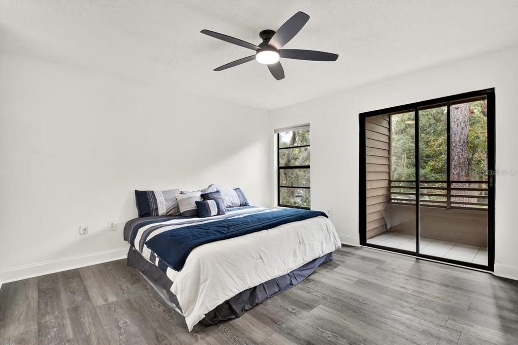 Primary bedroom with balcony access