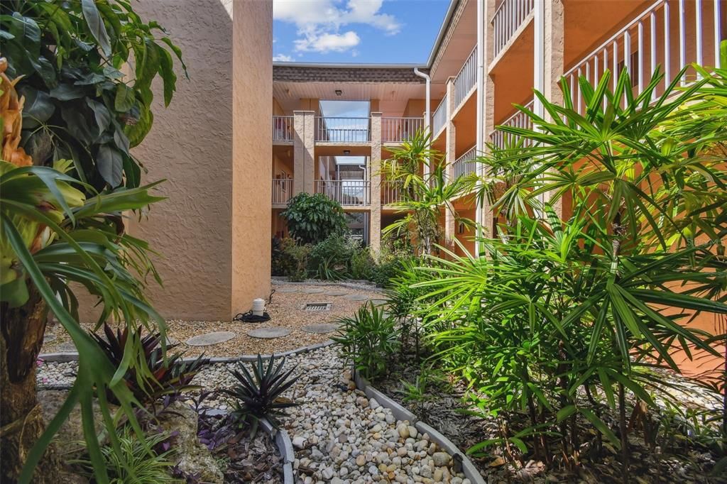 mature landscaped COURTYARD.