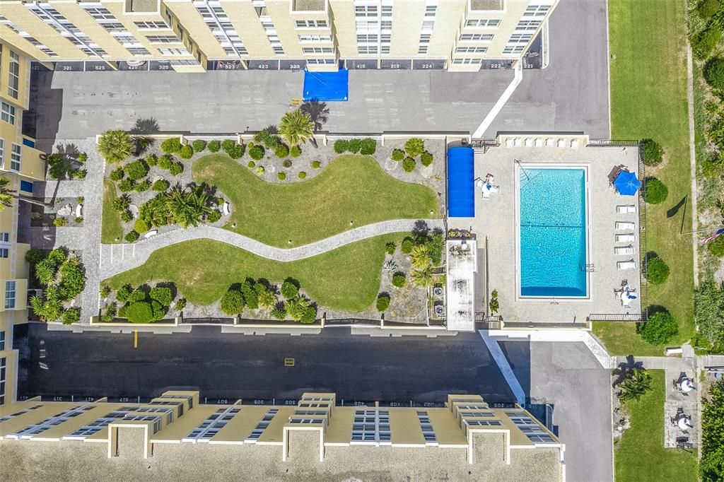 View of the pool, courtyard, and BBQ area.