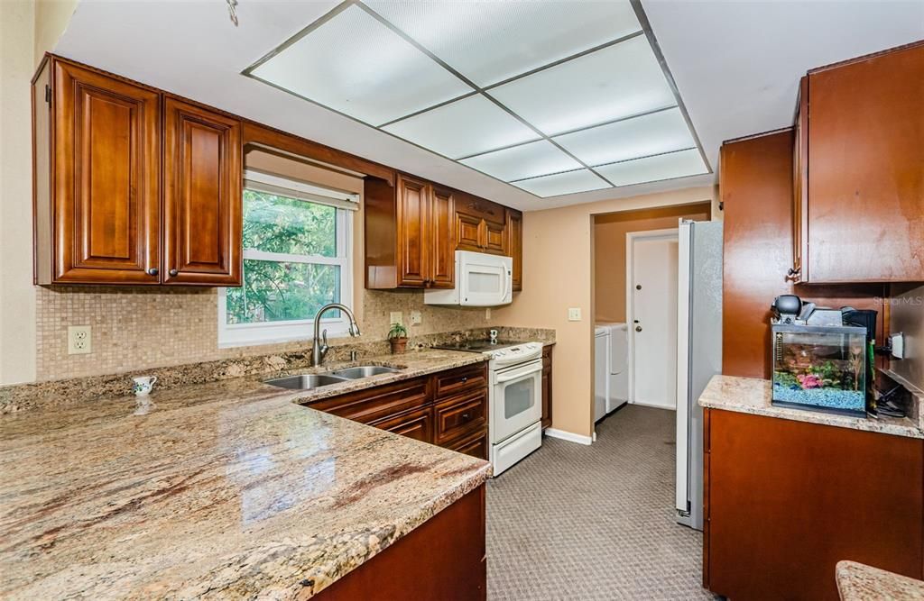 Kitchen with Granite Countertops and Wood Cabinets