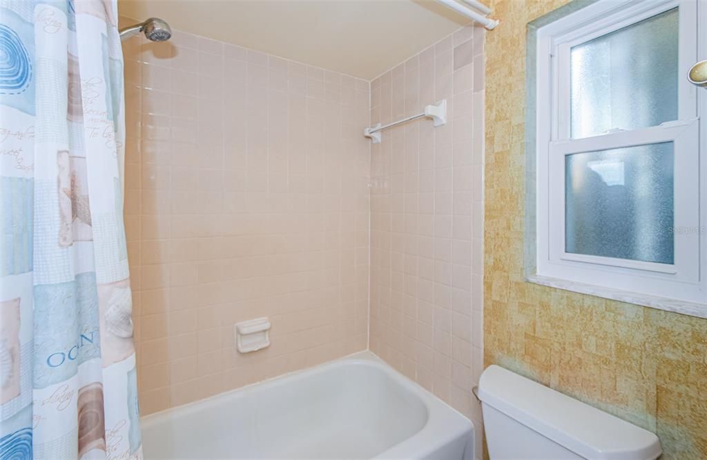 Primary Bath with Tiled Shower & Porcelain Tub