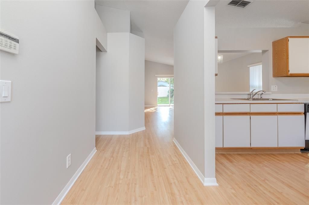 Front entry into the home's foyer with kitchen to the right.