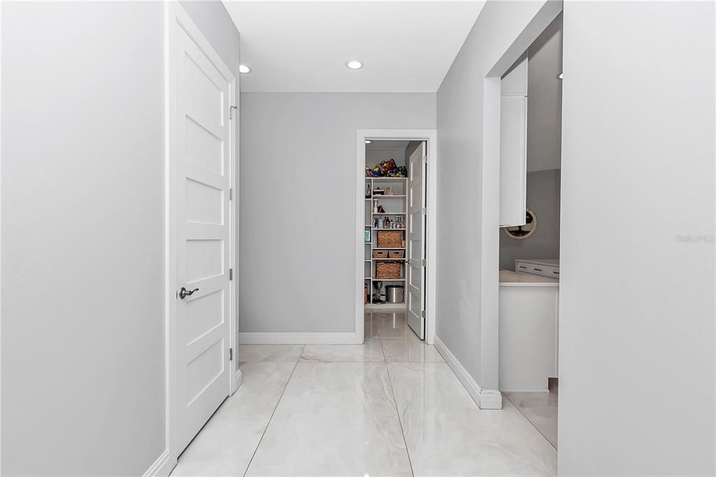 Half bathroom and walk in pantry off the garage entrance