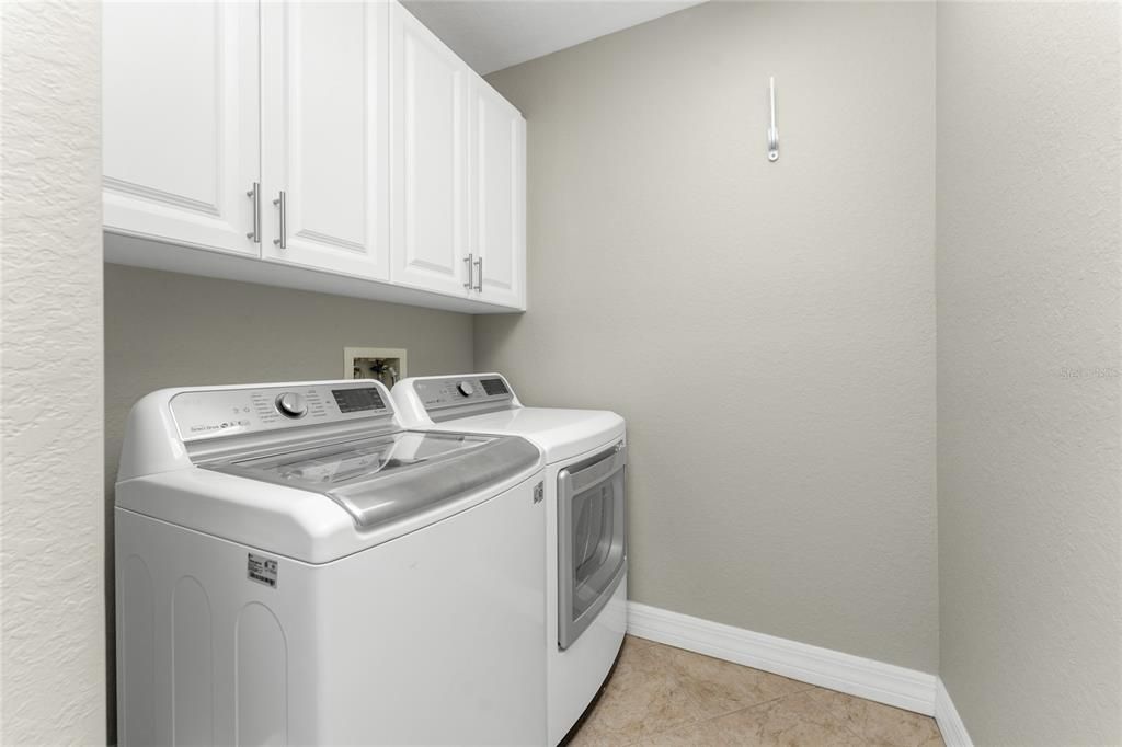 Laundry room with custom built cabinets