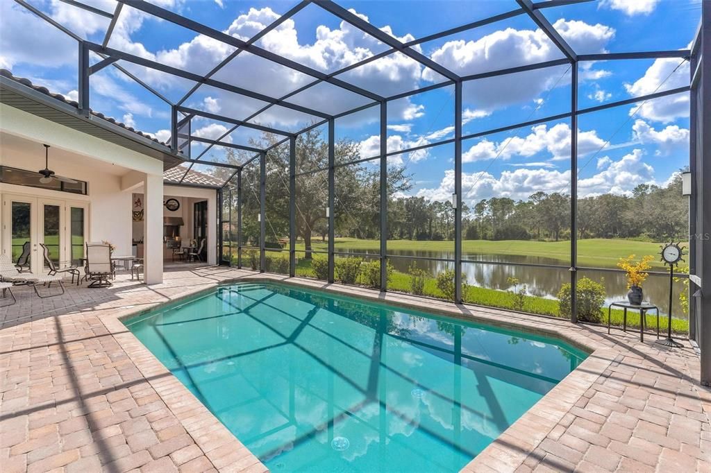 Lanai and Pool Area with Pond and Golf Course Views