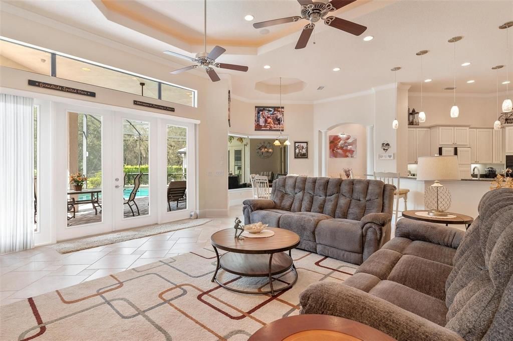 Living Area with French Doors leading to Lanai and Pool Area